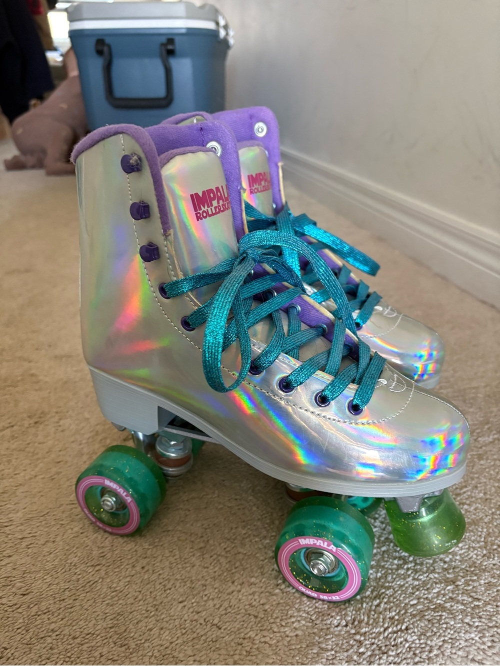 Impala women’s Holographic Roller Skates in Silver with Teal Laces